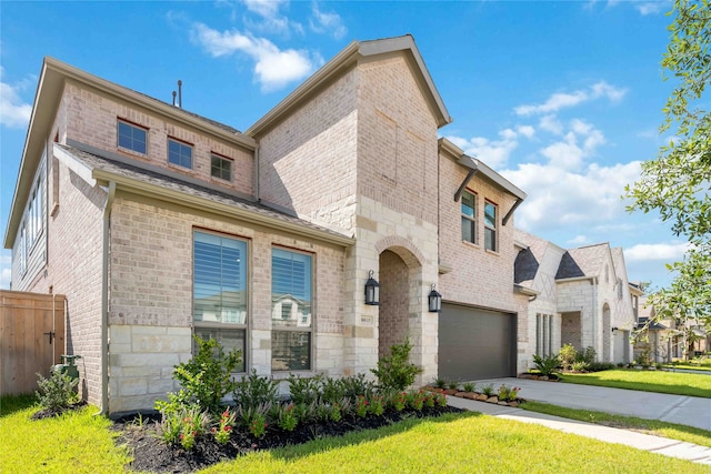 view of front of house featuring a front yard and a garage