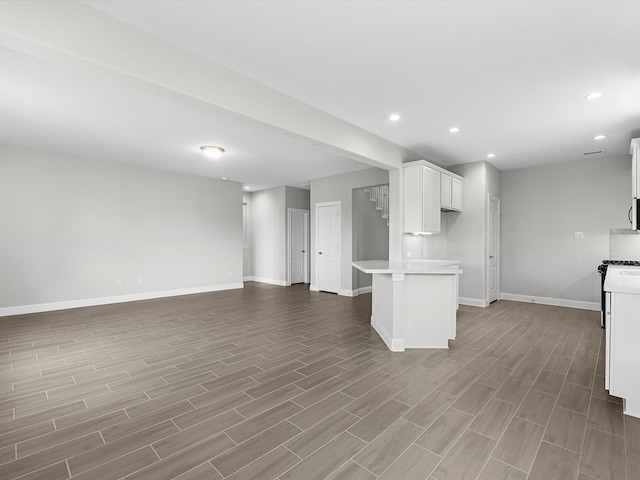 kitchen featuring white cabinets and light hardwood / wood-style flooring