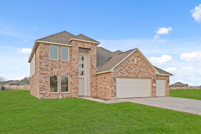 view of front property with a garage and a front yard