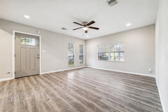 entryway featuring ceiling fan, plenty of natural light, and hardwood / wood-style flooring