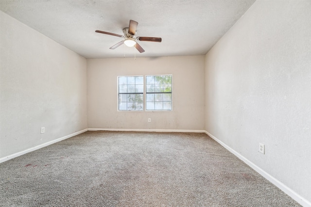 spare room featuring carpet, a textured ceiling, and ceiling fan