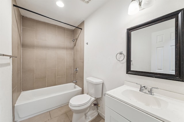 full bathroom with toilet, tile patterned flooring, vanity, and tiled shower / bath