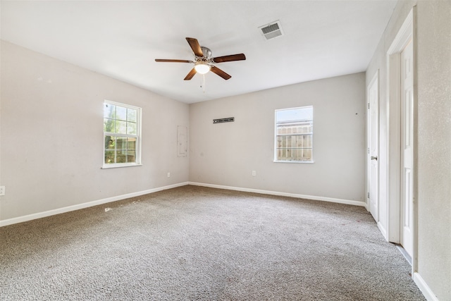 spare room with ceiling fan and carpet floors