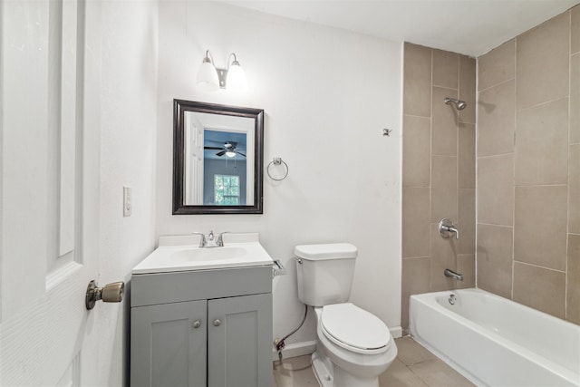 full bathroom featuring tile patterned flooring, vanity, toilet, and tiled shower / bath combo