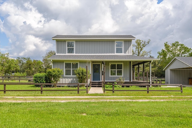 view of front of home with covered porch and a front yard