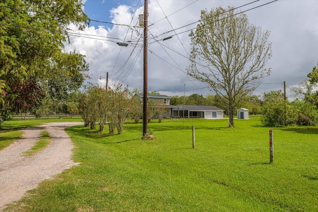 view of home's community featuring a lawn