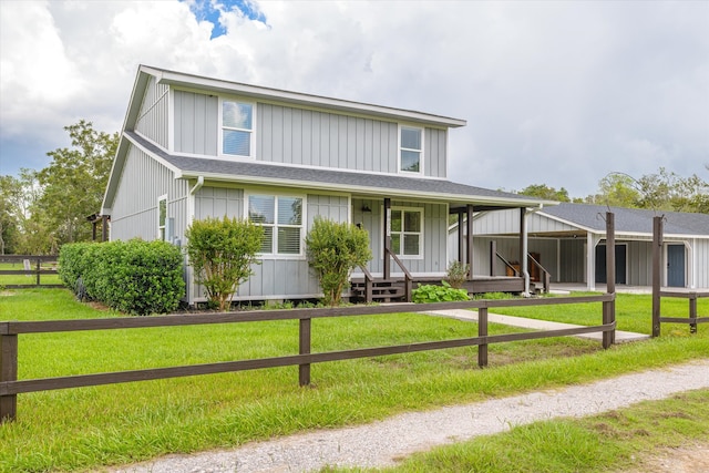 view of front of property with a front yard and covered porch