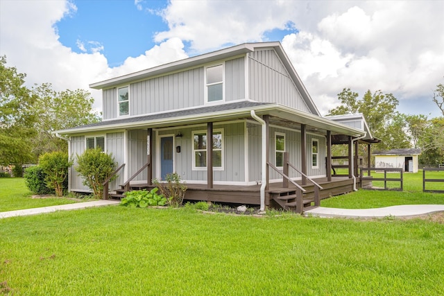 view of front facade featuring a front yard and covered porch