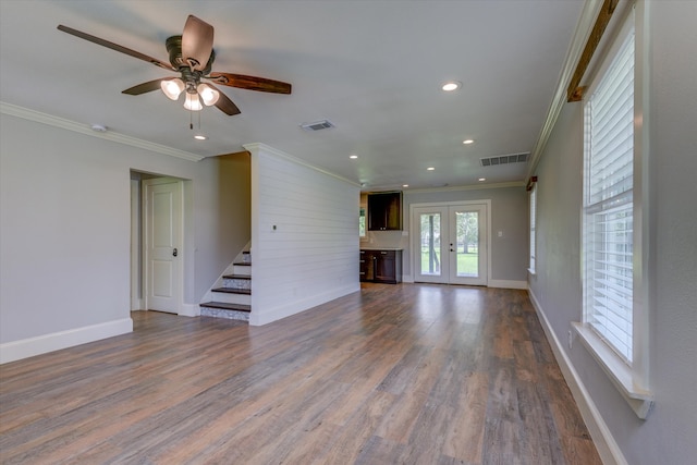 spare room featuring french doors, ornamental molding, dark hardwood / wood-style flooring, and ceiling fan