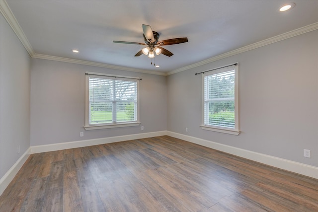 spare room with ceiling fan, crown molding, dark hardwood / wood-style flooring, and a wealth of natural light