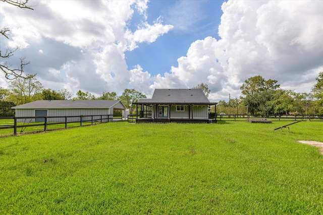 view of yard with a rural view