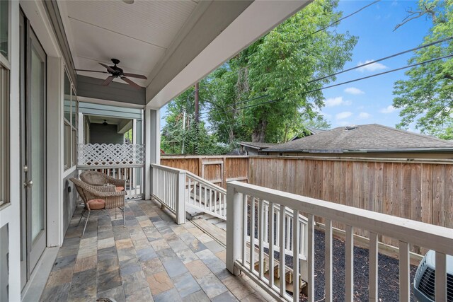 balcony featuring ceiling fan and a patio area