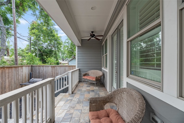 balcony featuring ceiling fan and a patio area