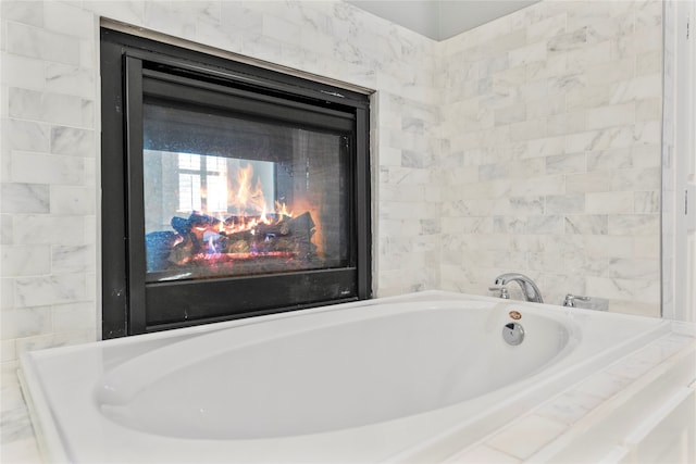 bathroom with tiled tub