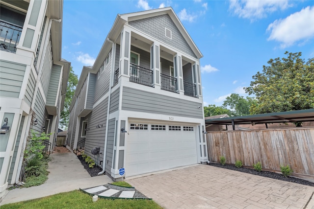 view of home's exterior featuring a balcony and a garage