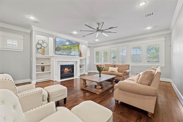 living room featuring ceiling fan, crown molding, and dark hardwood / wood-style flooring