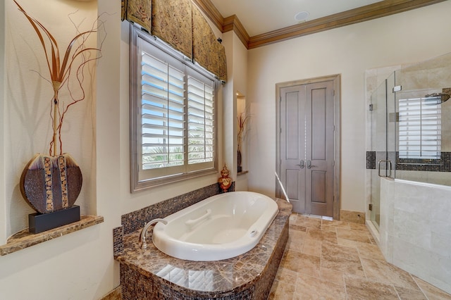 bathroom with separate shower and tub and crown molding