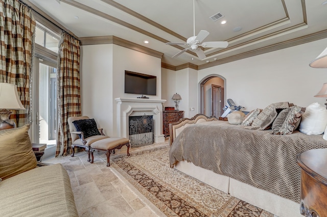 bedroom with ceiling fan, ornamental molding, and multiple windows