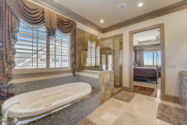 bathroom featuring a wealth of natural light, crown molding, and separate shower and tub