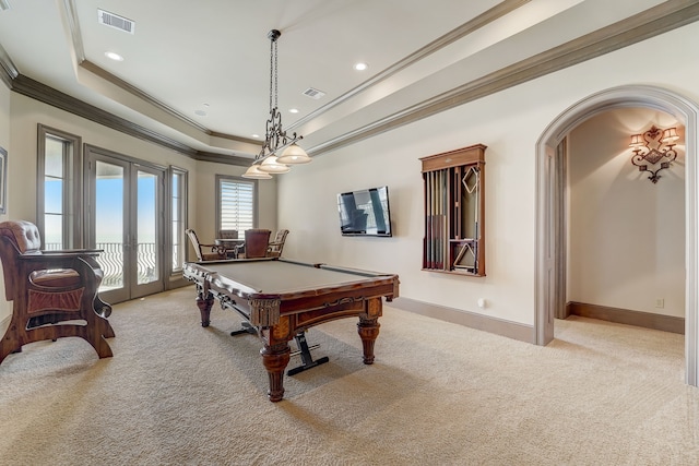 rec room with a raised ceiling, french doors, light colored carpet, billiards, and crown molding