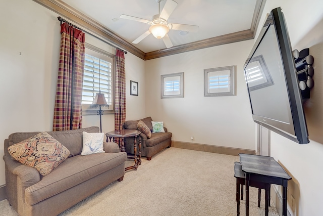 living room with ceiling fan, carpet floors, and ornamental molding