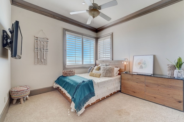 carpeted bedroom with ceiling fan and crown molding