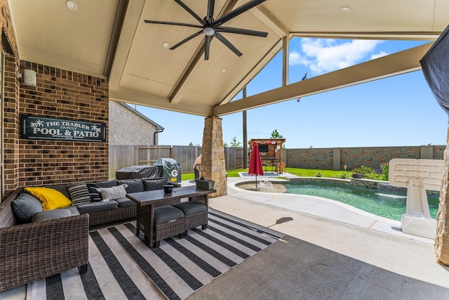 view of patio / terrace with ceiling fan, a fenced in pool, outdoor lounge area, and pool water feature