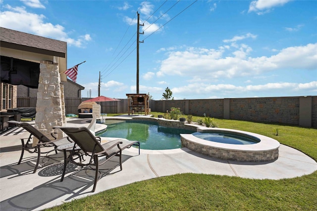 view of pool featuring a yard, an in ground hot tub, and a patio