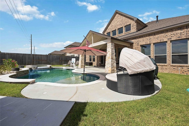 view of swimming pool featuring a patio and a lawn