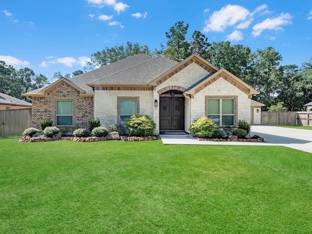 view of front of property with a front lawn