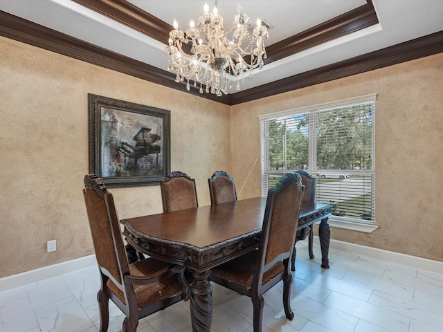 dining space with a raised ceiling, crown molding, and a chandelier