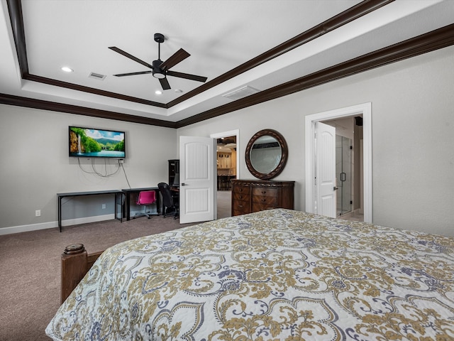 carpeted bedroom with a tray ceiling, ceiling fan, and crown molding