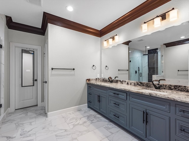 bathroom with vanity, crown molding, and a shower with door