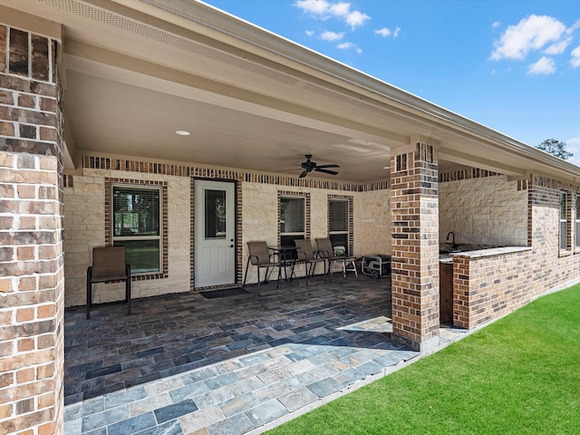 view of patio featuring ceiling fan