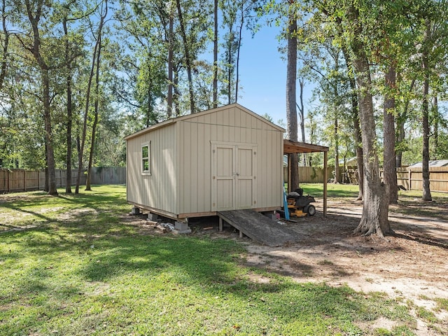 view of outdoor structure with a lawn