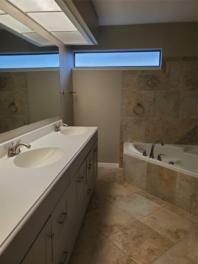 bathroom with shower with separate bathtub, vanity, and a wealth of natural light