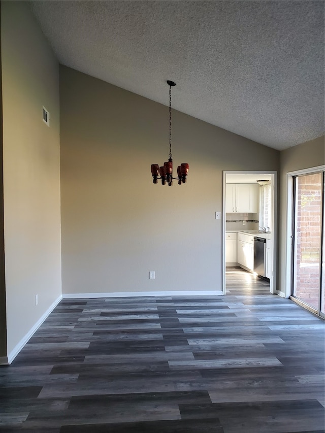 unfurnished dining area with high vaulted ceiling, a chandelier, a textured ceiling, and dark wood-type flooring