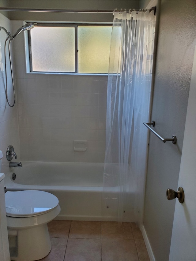 bathroom with shower / bath combo, toilet, and tile patterned floors