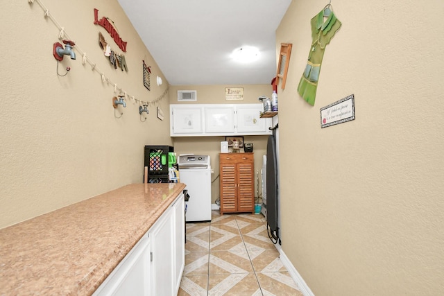 5522 Cannonway Dr, Houston, TX 77032 - kitchen featuring visible vents, washer / clothes dryer, light countertops, white cabinets, and light tile patterned floors