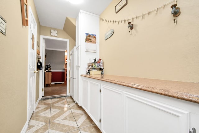 hallway with light tile patterned floors