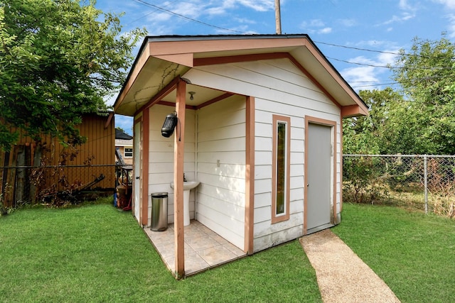 view of outdoor structure with a yard