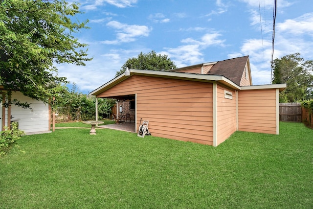 exterior space featuring a yard and a patio area