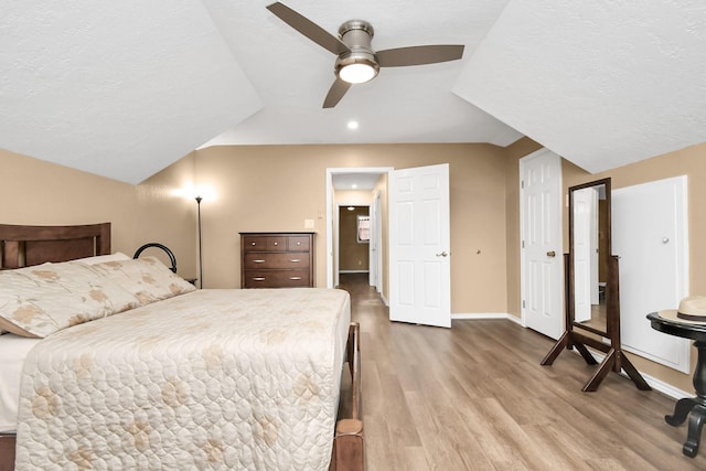 5522 Cannonway Dr, Houston, TX 77032 - bedroom with a ceiling fan, a textured ceiling, wood finished floors, baseboards, and recessed lighting