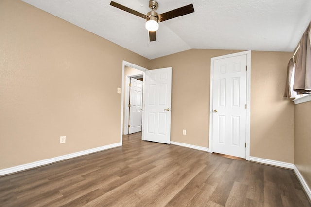 5522 Cannonway Dr, Houston, TX 77032 - unfurnished bedroom featuring baseboards, ceiling fan, wood finished floors, and lofted ceiling