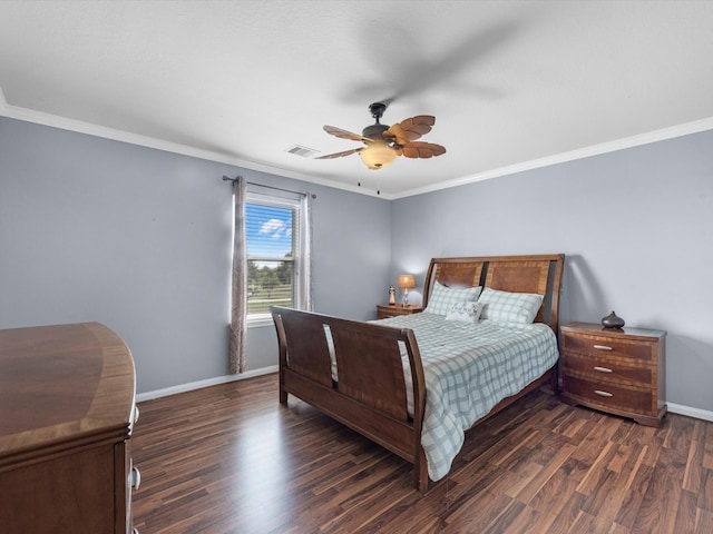 bedroom featuring crown molding, dark wood-type flooring, and ceiling fan