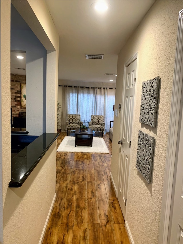 hallway featuring wood-type flooring