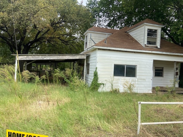 exterior space featuring a carport