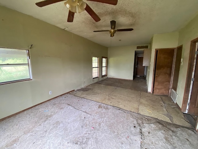 unfurnished bedroom with ceiling fan and multiple windows