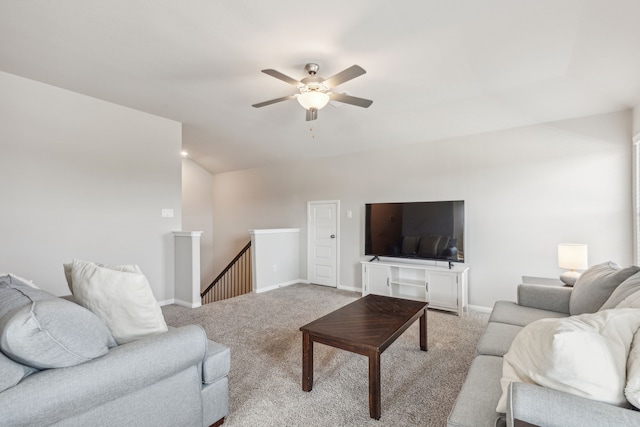 living room featuring light colored carpet and ceiling fan