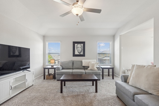 living room with light carpet, vaulted ceiling, plenty of natural light, and ceiling fan